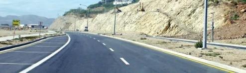 Sealed highway cut through Papua New Guinean terrain
